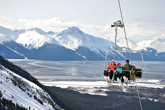 Ski Lift Over Snowy Mountains with Travelers, Highlighting Group Tours Ohio