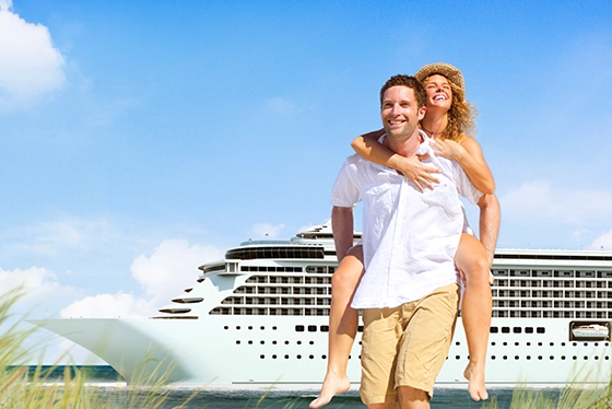 Smiling Couple Enjoying a Day at Sea Near a Cruise Ship