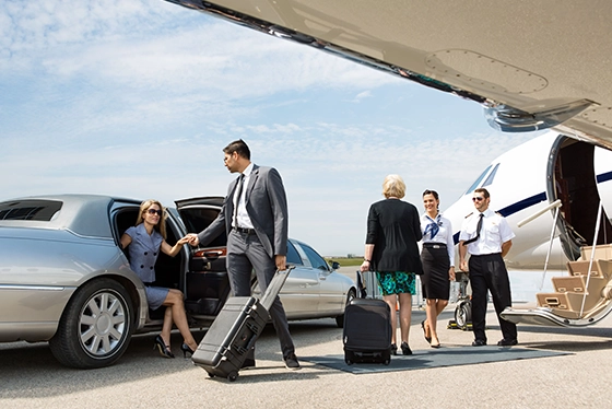 Business Travelers Arriving at a Private Jet with Ohio Travel Agency Services