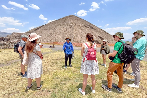 Tourists Listening to Guide Near Pyramid, Perfect for Group Tours Ohio