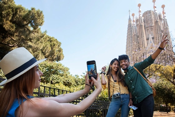Happy Tourists Posing Near Iconic Landmark on European Vacation
