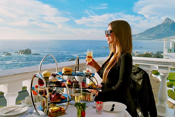 Woman Enjoying Seaside Breakfast at Luxury Resort with Ocean View